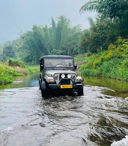 Jeep safari crossing a river near Kodaikanal