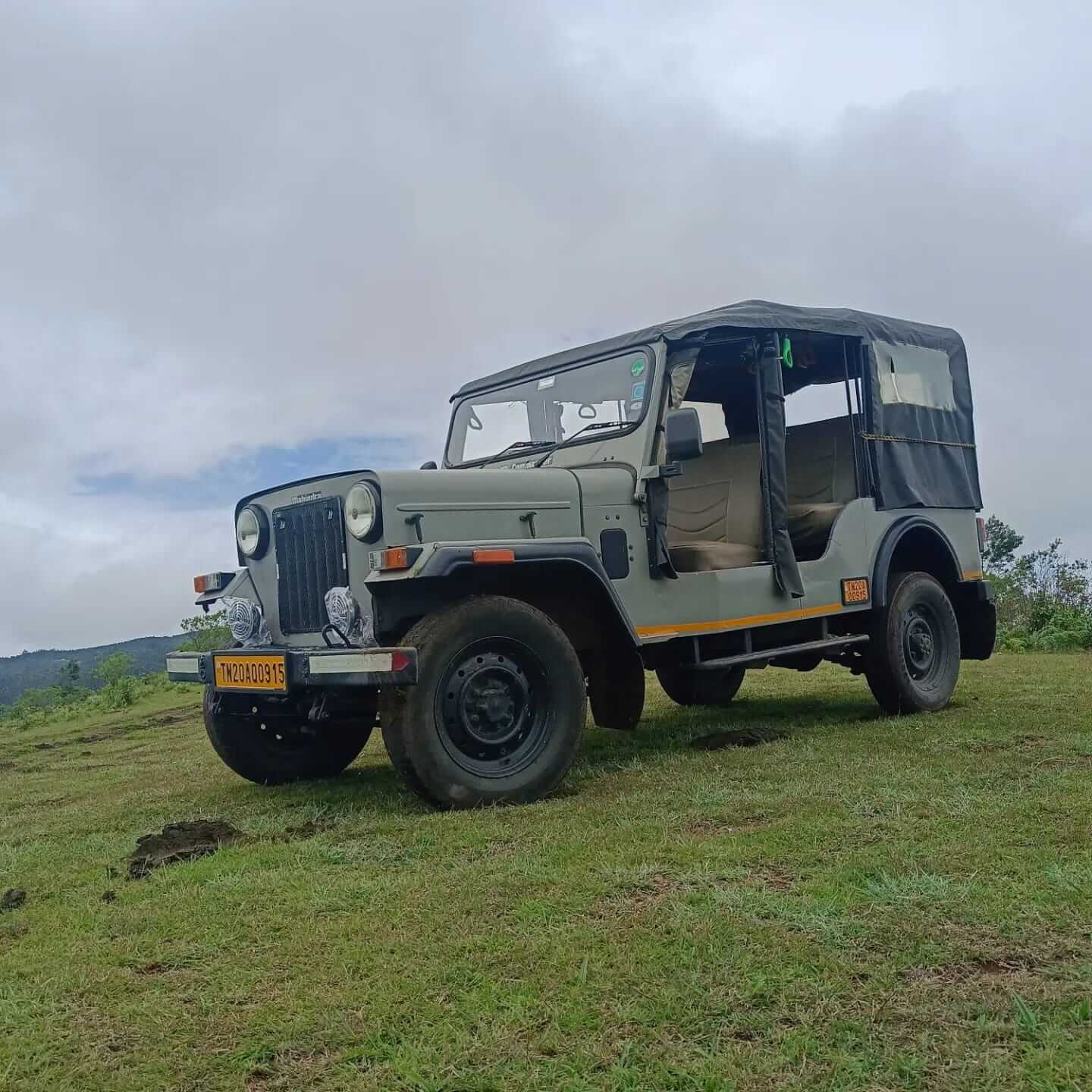 Open jeep parked on a Kodaikanal hilltop
